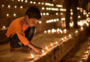 Adult supervising children lighting firecrackers safely