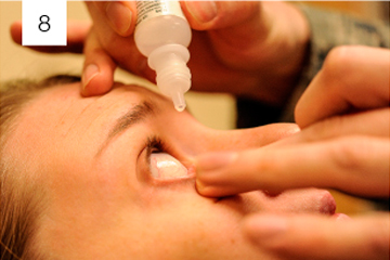Ophthalmologist checking patient for monsoon conjunctivitis and dry eyes