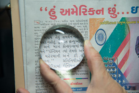 Optical magnifiers and assistive low vision aids for reading and daily tasks