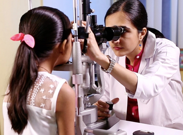 Child practicing the 20-20-20 rule during online classes to reduce eye strain